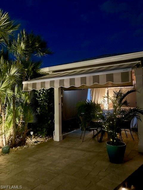 Patio at twilight with outdoor dining space