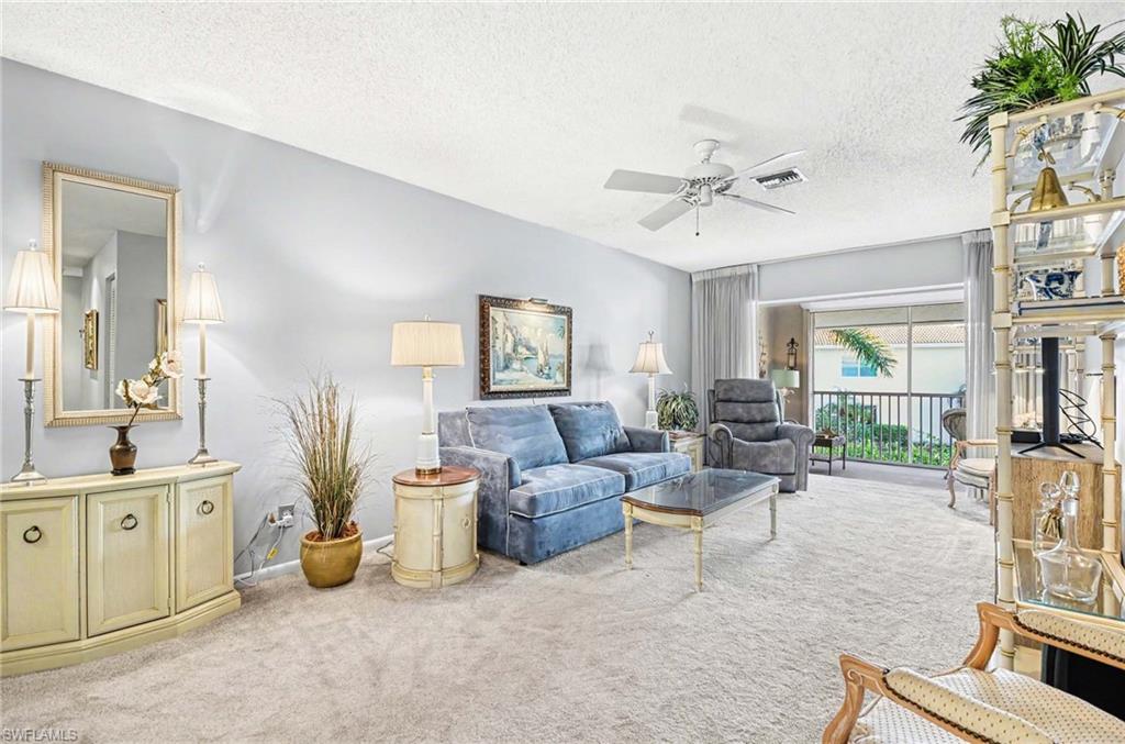 Recessed lighting, ceiling fan, and carpeted flooring
