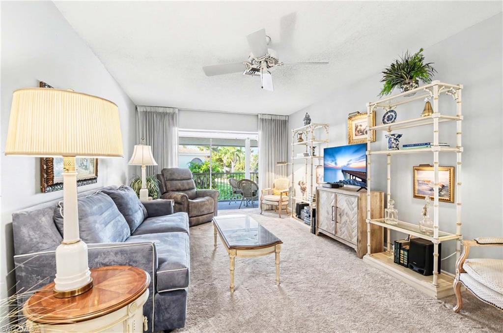 Recessed lighting with ceiling fan, light gray wall paint, and wall-to-wall carpeting
