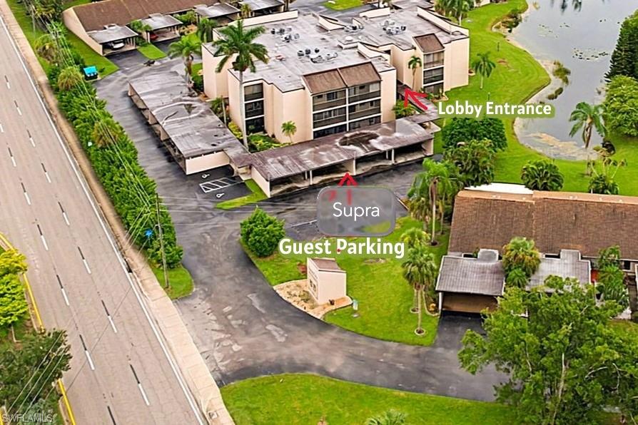 Turn off Cypress Lake make an immediate left then right to Guest parking. Supra is hanging on a Chain by the wall under car port. Go to the Lobby entrance and use the Bronze color key for all exterior doors. Other key for condo