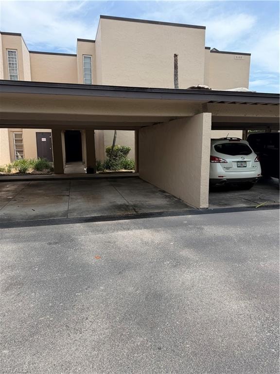 Parking space to the right is for 206. The brown door takes you to the stairwell up to 206.