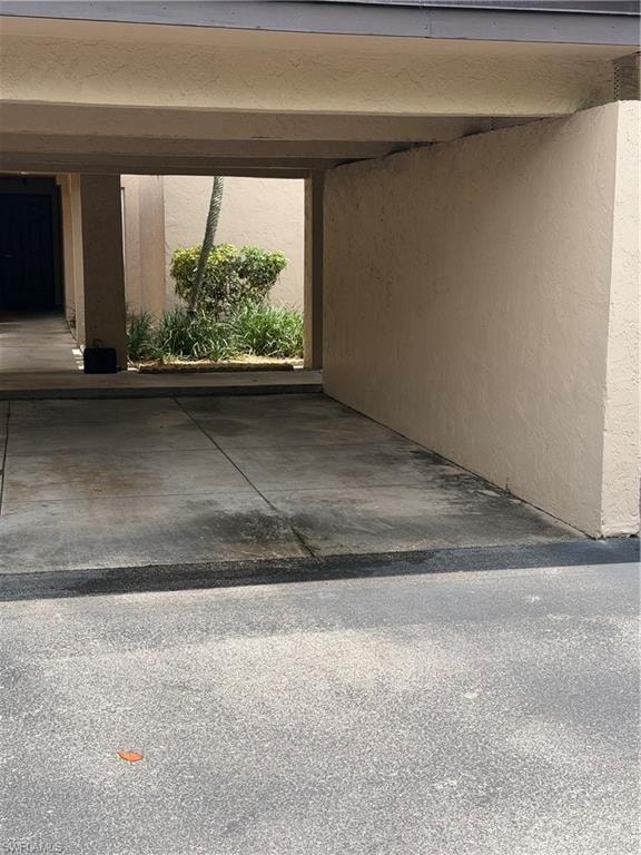 Parking space to the right is for 206. The brown door takes you to the stairwell up to 206.