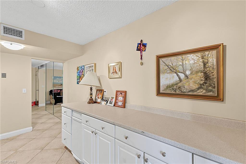 Counter opposite stove, and sink.