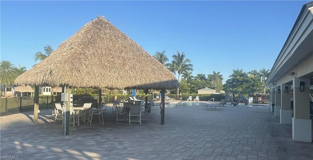 Surrounding community with a patio and a pool