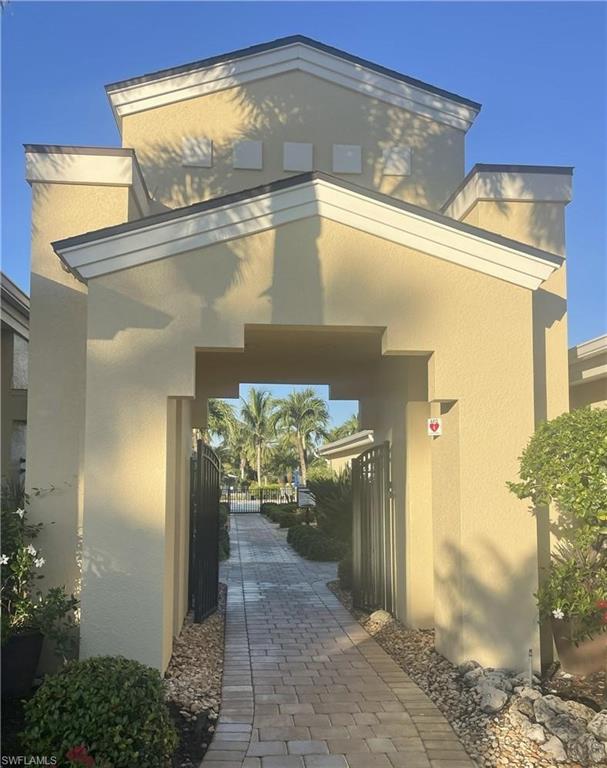 View of exterior entry featuring stucco siding