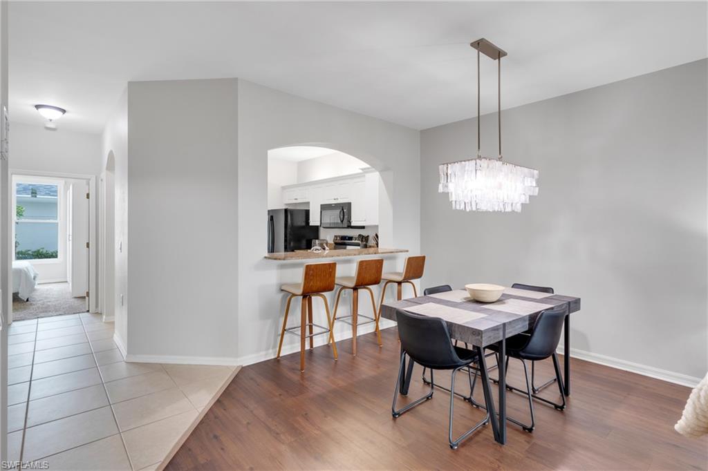 Wood-finish flooring with a modern linear chandelier