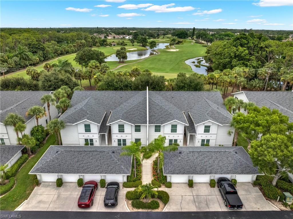 Aerial perspective highlighting a multi-unit property with a golf course backdrop