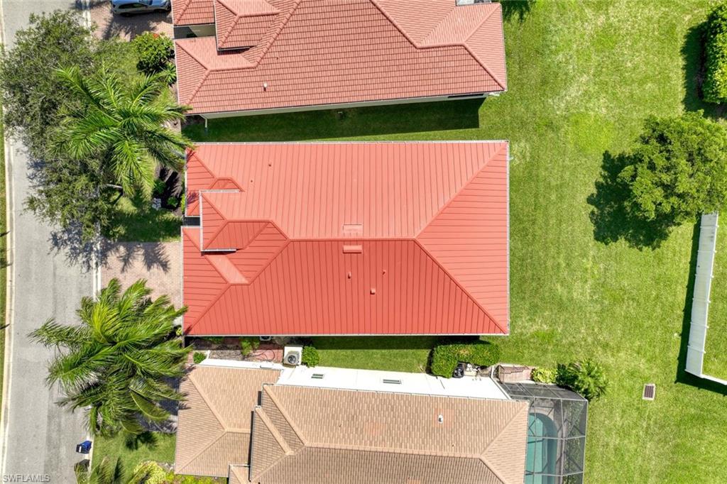 Red-toned metal roofing with multiple gables