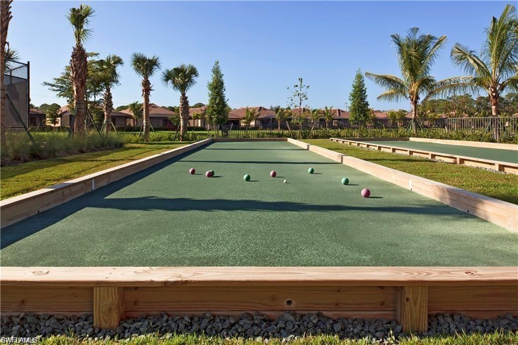 Surrounding community with a bocce ball area and a residential view