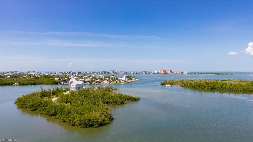 Waterfront setting with expansive water frontage and island landscaping