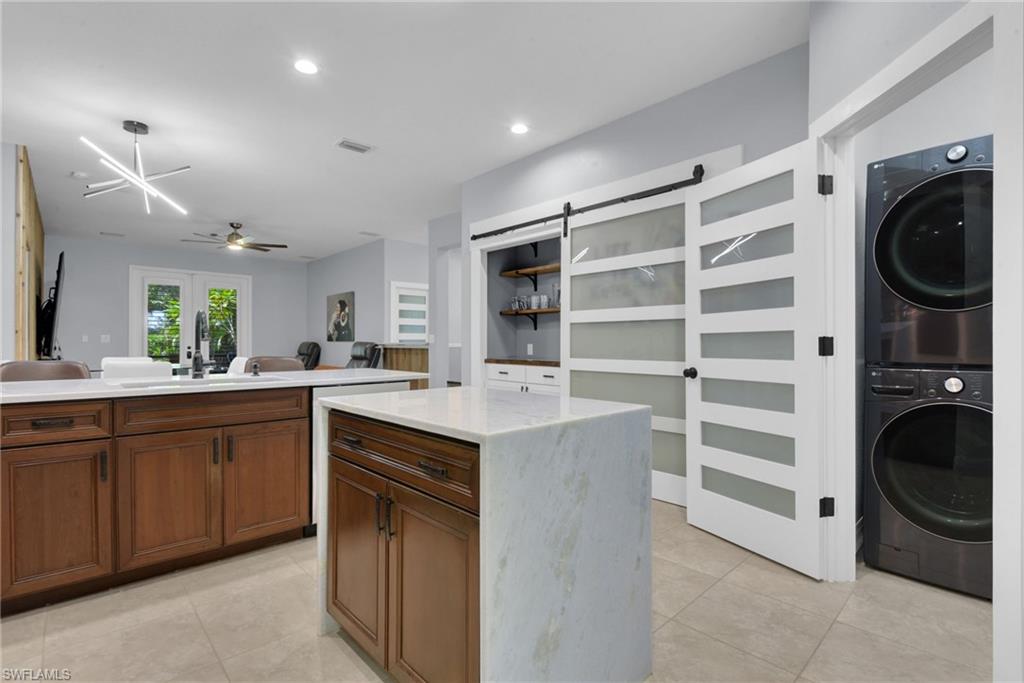 Laundry Closet Off Of Kitchen & Sliding Door On Pantry