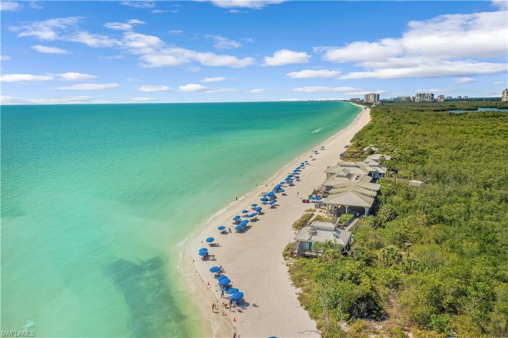 Drone / aerial view featuring a water view and a view of the beach