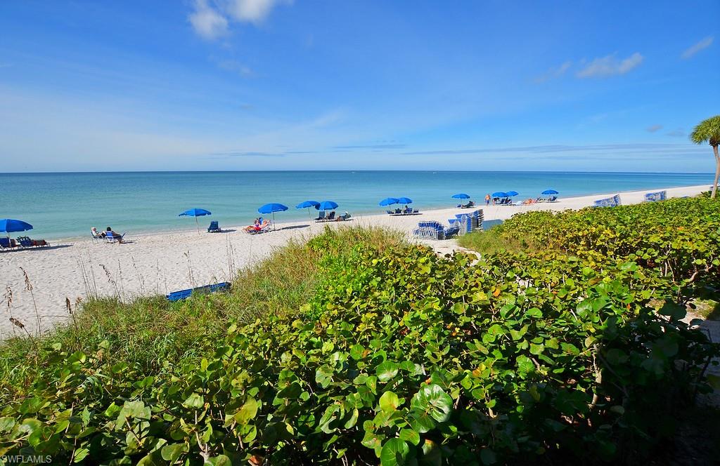 Property view of water featuring a beach view