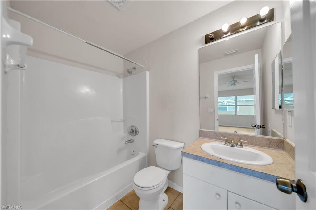 White tub and shower combination with chrome fixtures