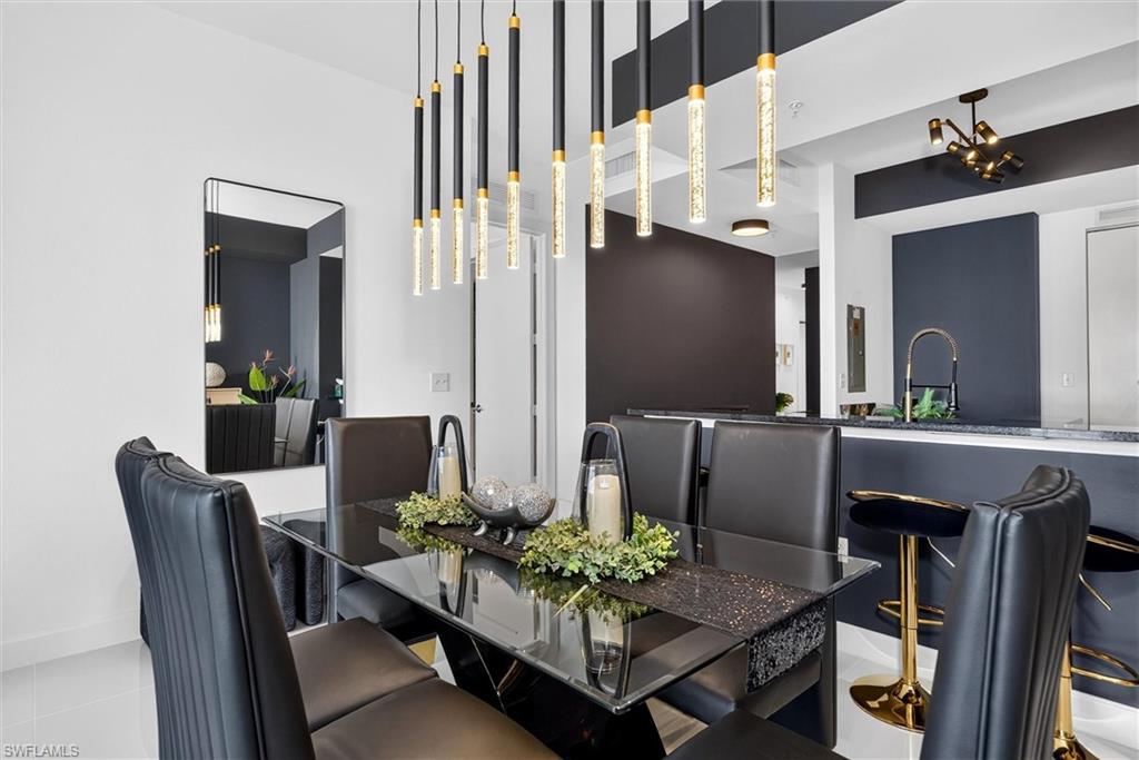 Contemporary pendant lighting fixtures illuminate the space, complemented by recessed lighting