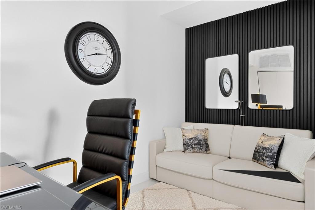 White wall with black accent paneling