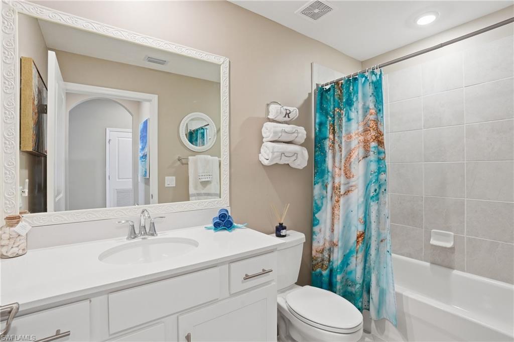 White vanity with an integrated sink and chrome faucet