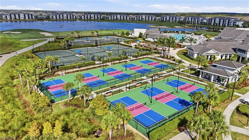 Multiple pickleball courts, several tennis courts, a large swimming pool, and a golf course