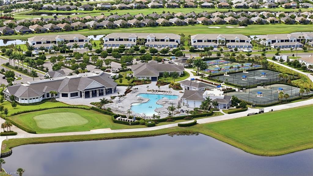 Community featuring a clubhouse, swimming pool, multiple tennis courts, and golf course access