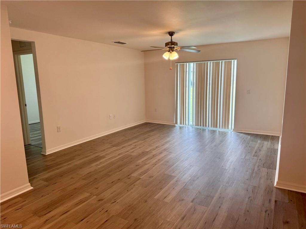 Spare room with light wood-style floors and ceiling fan