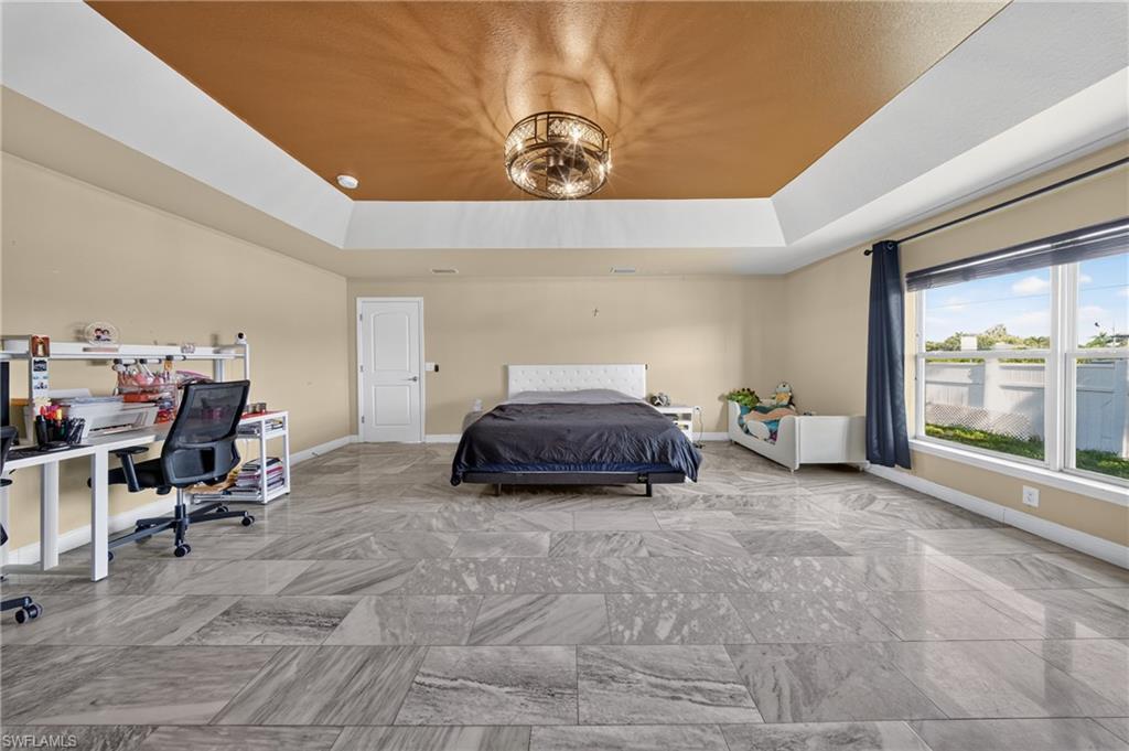 Tray ceiling with a central decorative light fixture