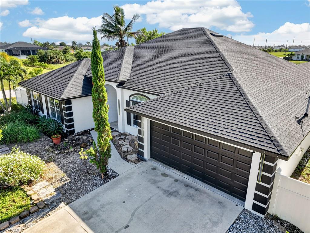 White stucco exterior with black trim accents