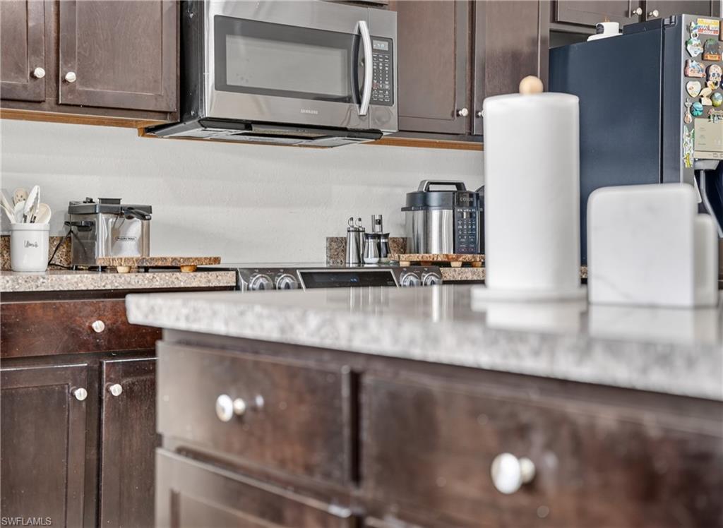 Dark wood-finish cabinetry with white knob hardware