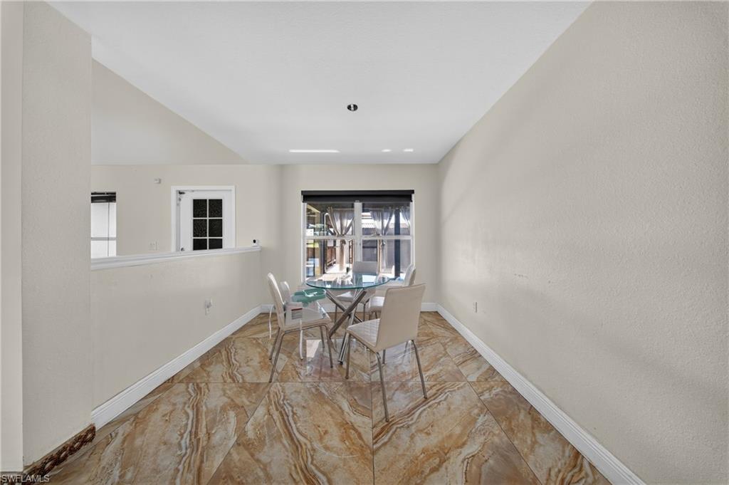 Vaulted ceilings and a half wall create an open atmosphere