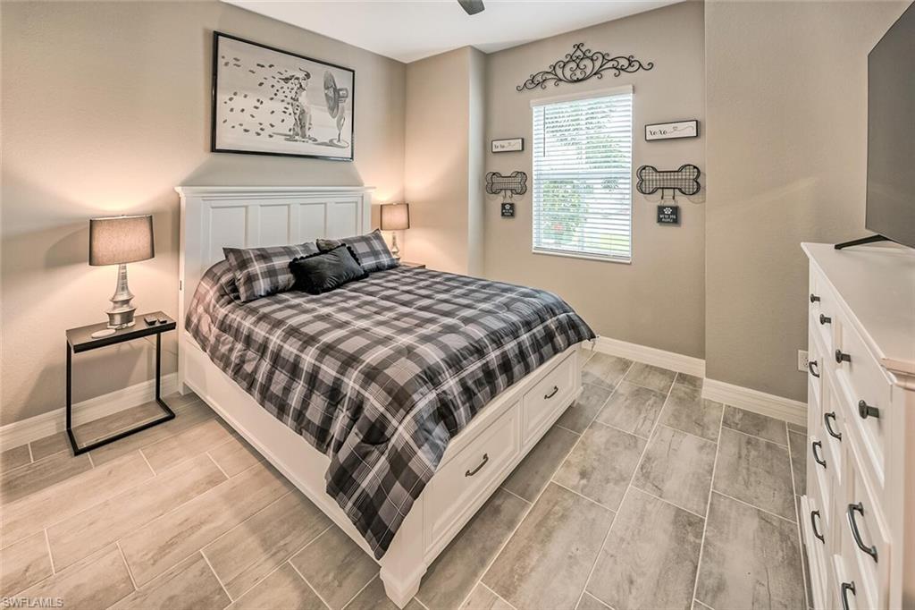 Bedroom featuring baseboards and wood finish floors