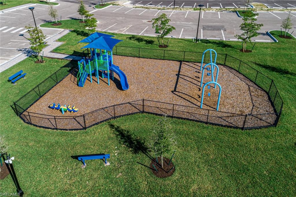 Community jungle gym with a yard