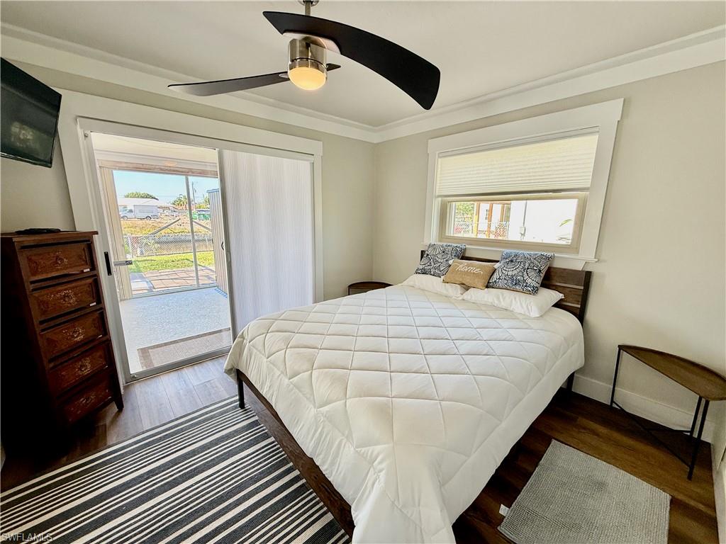 Wood-finish flooring with a sliding glass door offering direct outdoor access