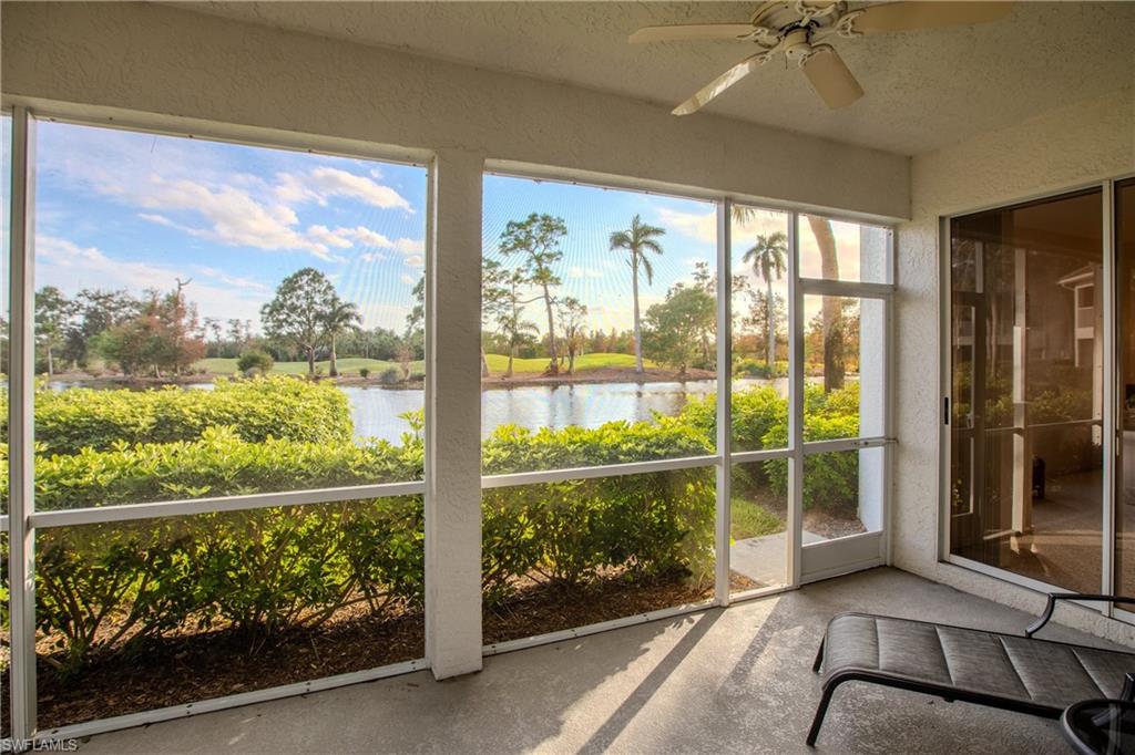 Unfurnished sunroom featuring a water view and ceiling fan