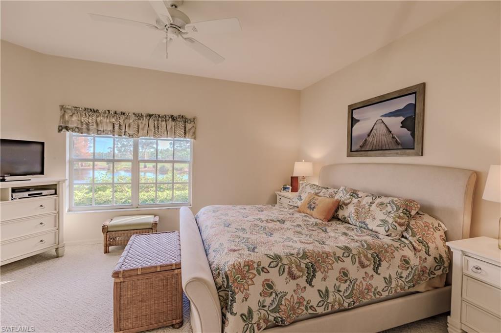 Bedroom featuring light carpet and ceiling fan