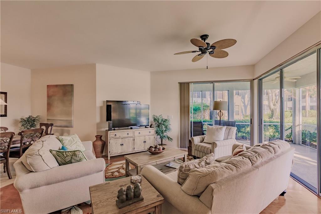 Living room featuring light hardwood / wood-style floors and ceiling fan