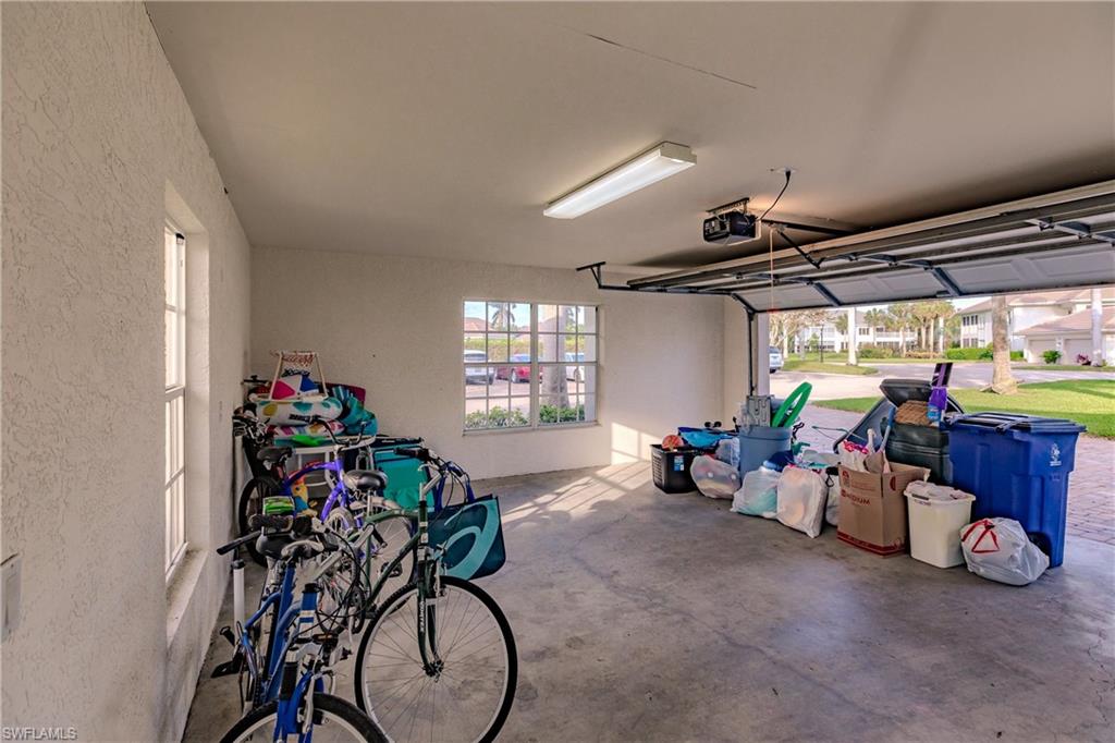 Garage featuring a garage door opener
