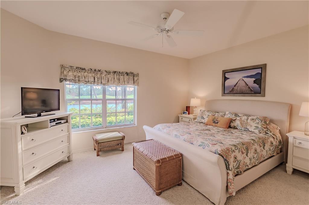 Bedroom featuring light carpet and ceiling fan