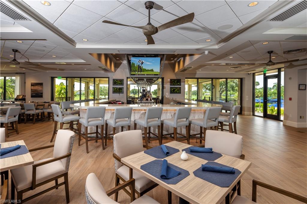 Dining room with french doors, ceiling fan, and light wood-type flooring