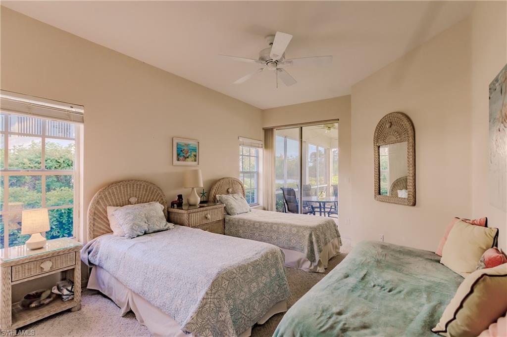Bedroom featuring carpet flooring, multiple windows, a closet, and ceiling fan