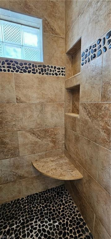 Bathroom with tiled shower