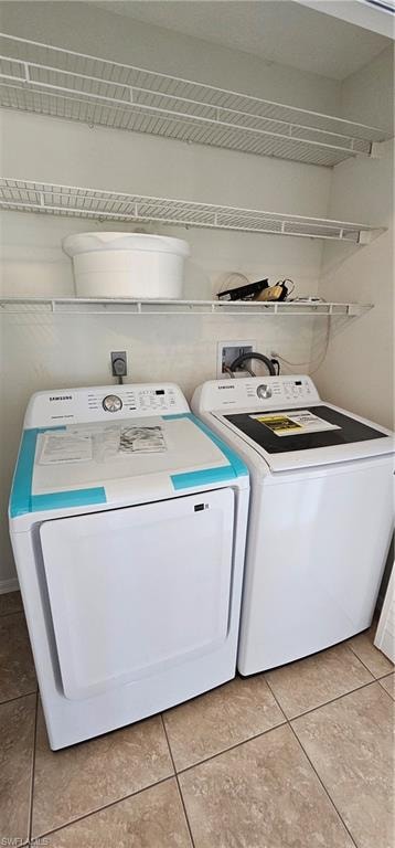 Laundry area with washer and clothes dryer