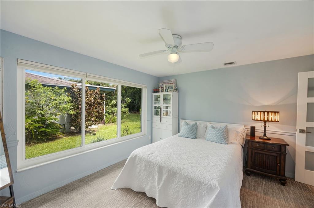 Expansive window overlooking green landscaping