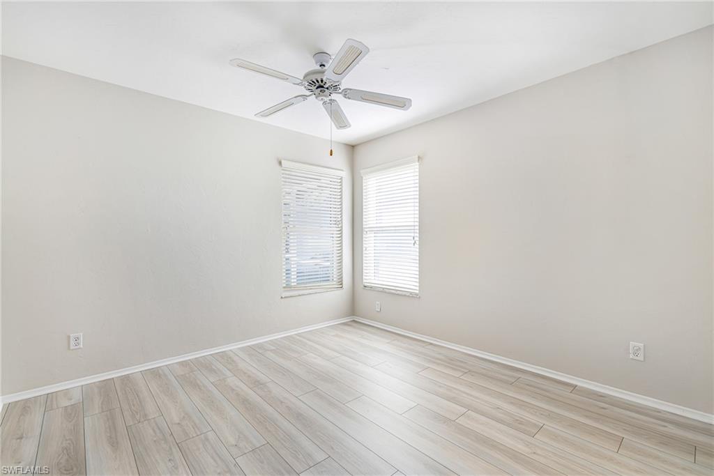 Neutral-toned walls complement wood-finish flooring