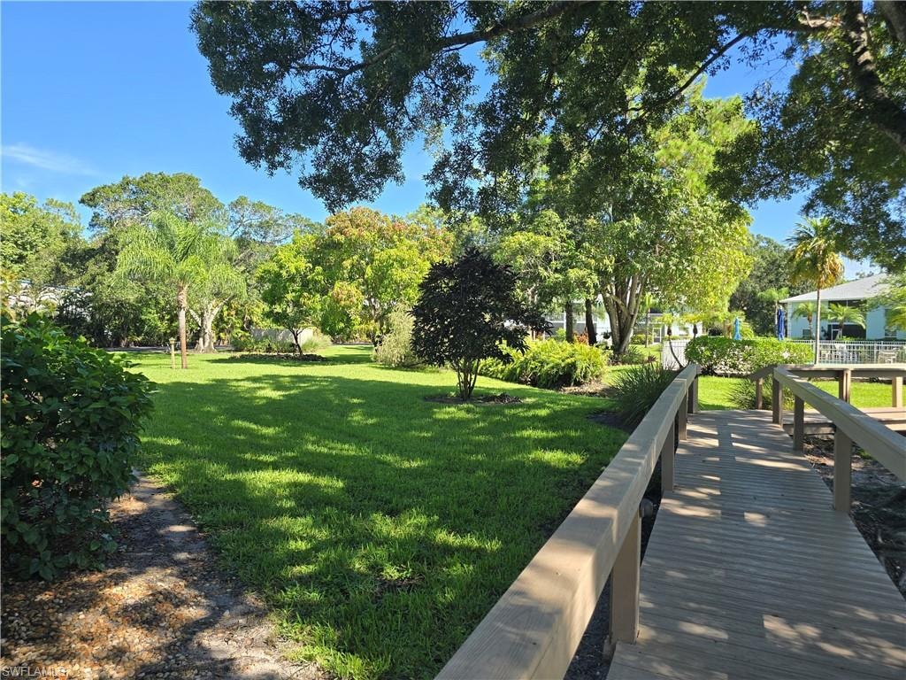 Landscaping and open area surrounds the pool area