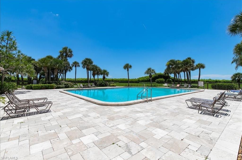 Community pool featuring a patio area