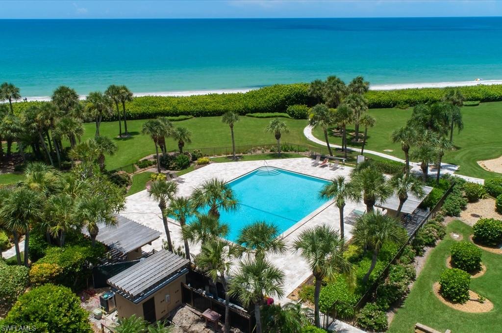 Drone / aerial view of a pool and unending shoreline