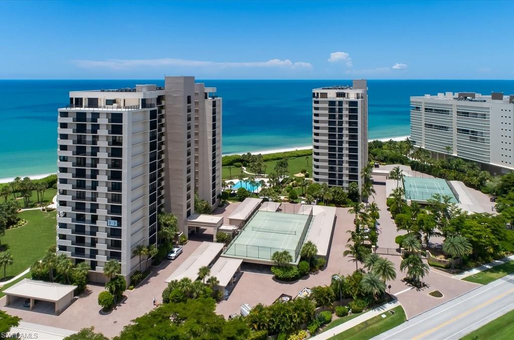 Aerial view of a large body of water and apartment complex / building