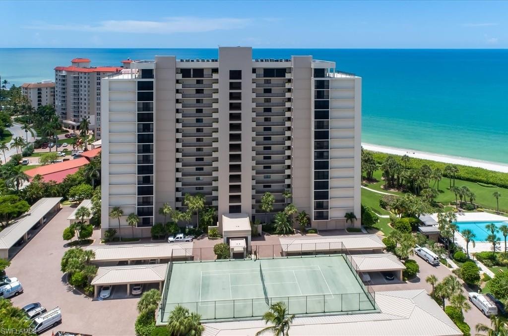 View of apartment building / complex featuring a water view