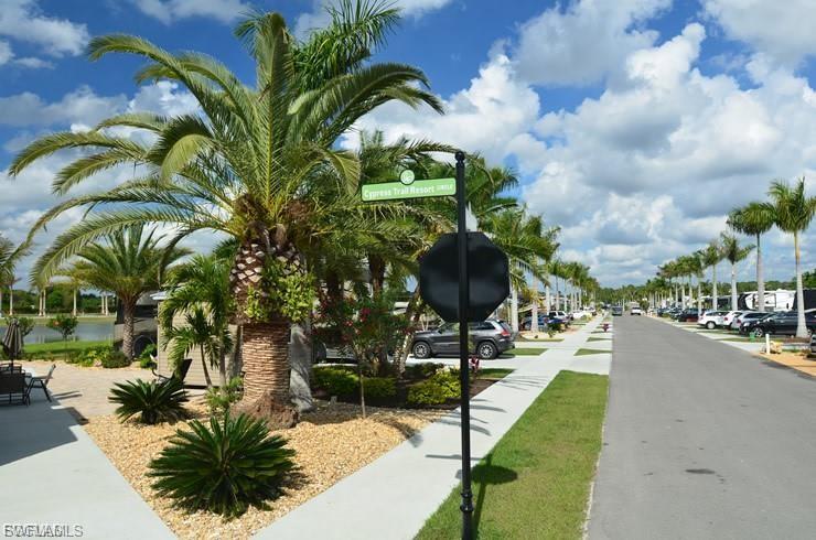 View of asphalt street featuring sidewalks