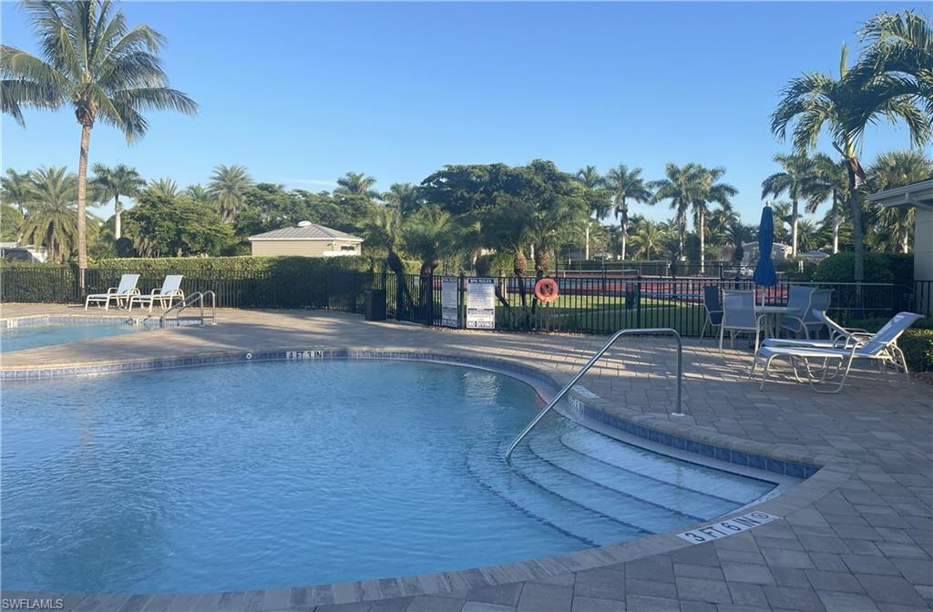 Community pool featuring a patio