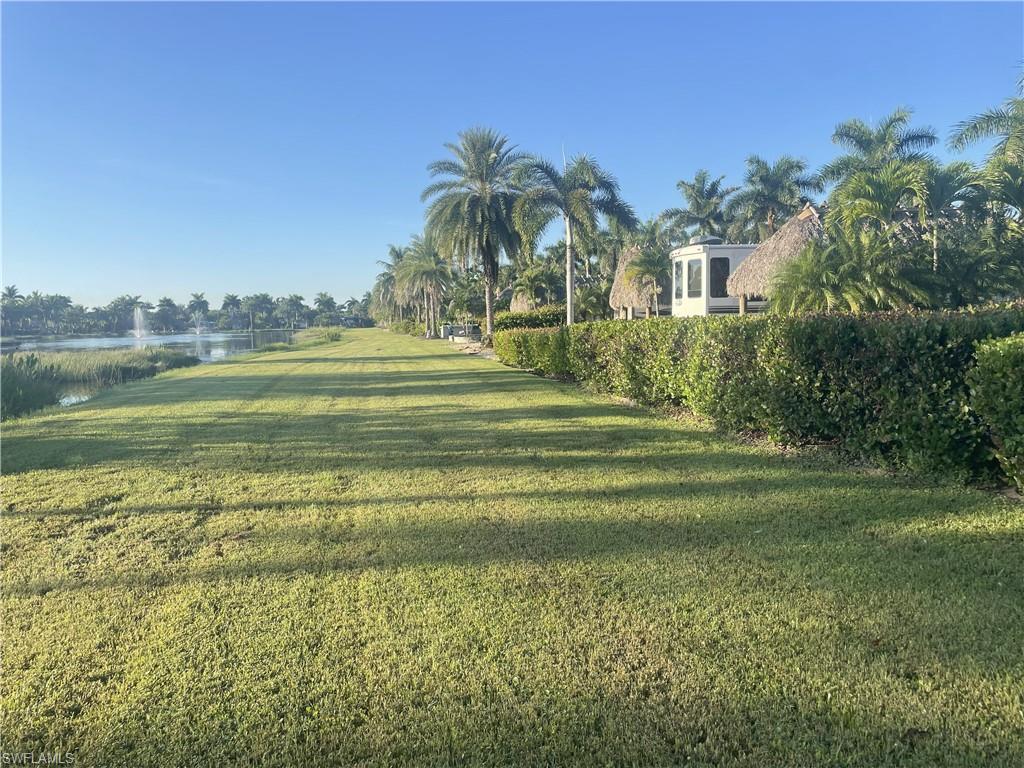 View of grassy yard featuring a water view